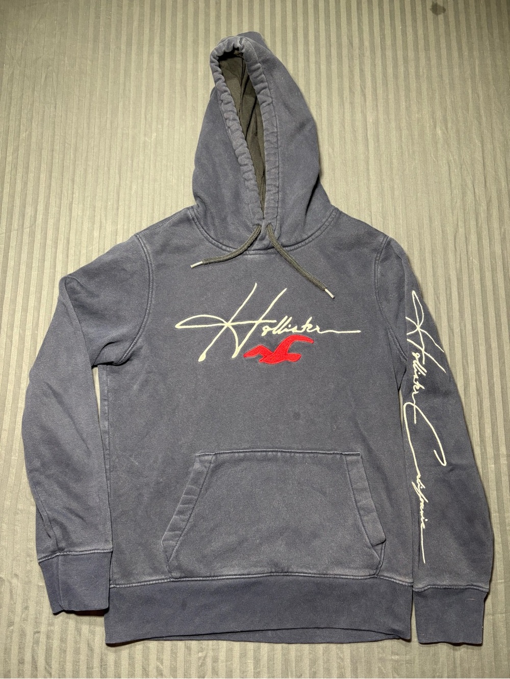 Hollister Men's Navy Pullover Hoodie with Script Logo